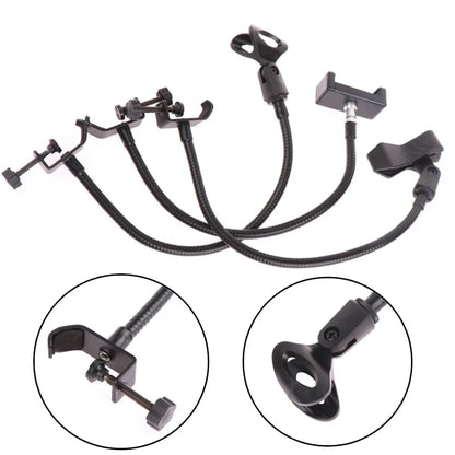 Set of five black flexible gooseneck microphone stands with adjustable clamps for radio broadcasting studio live broadcast equipment stations