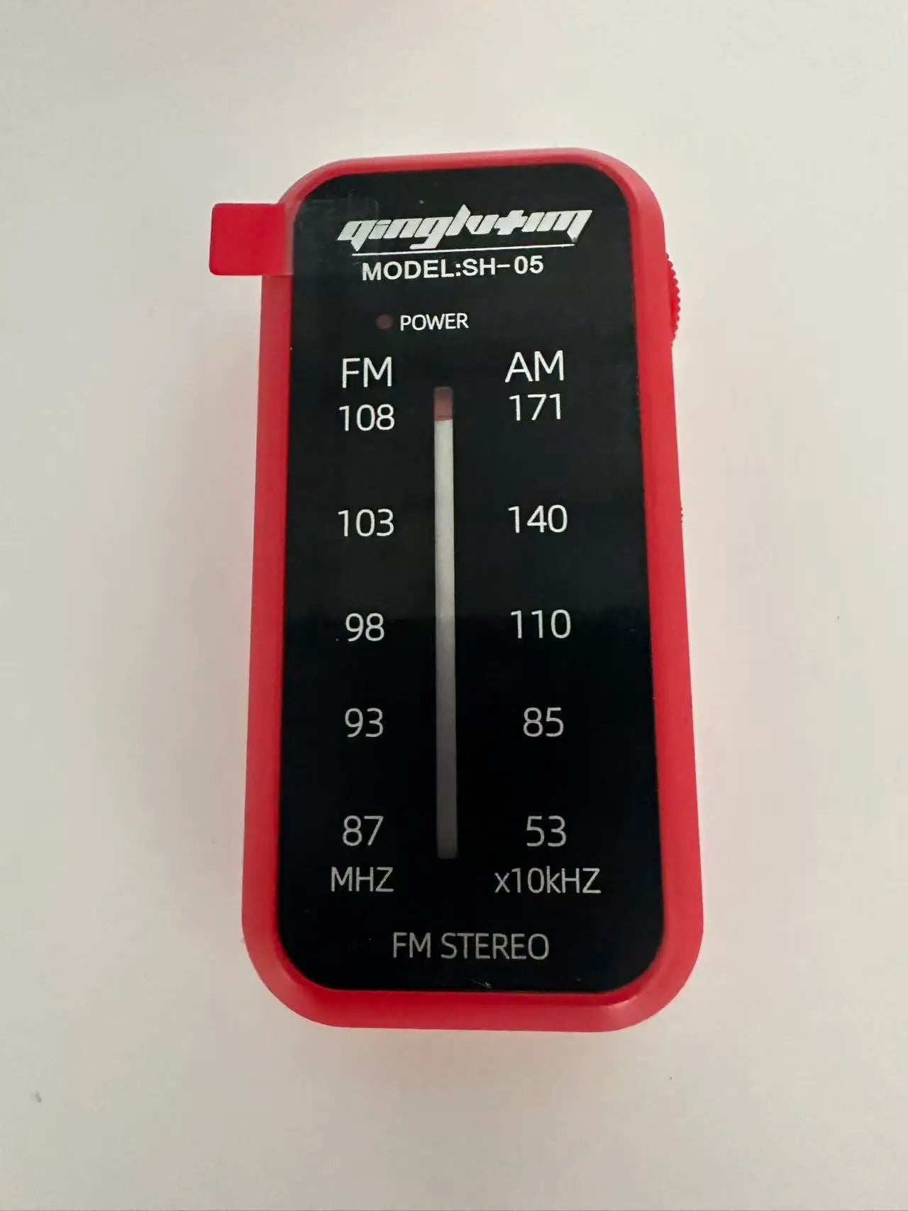 Red plastic portable fm/am mini radio with black display panel 5mm headphone jack and jack built-in speaker loud sound