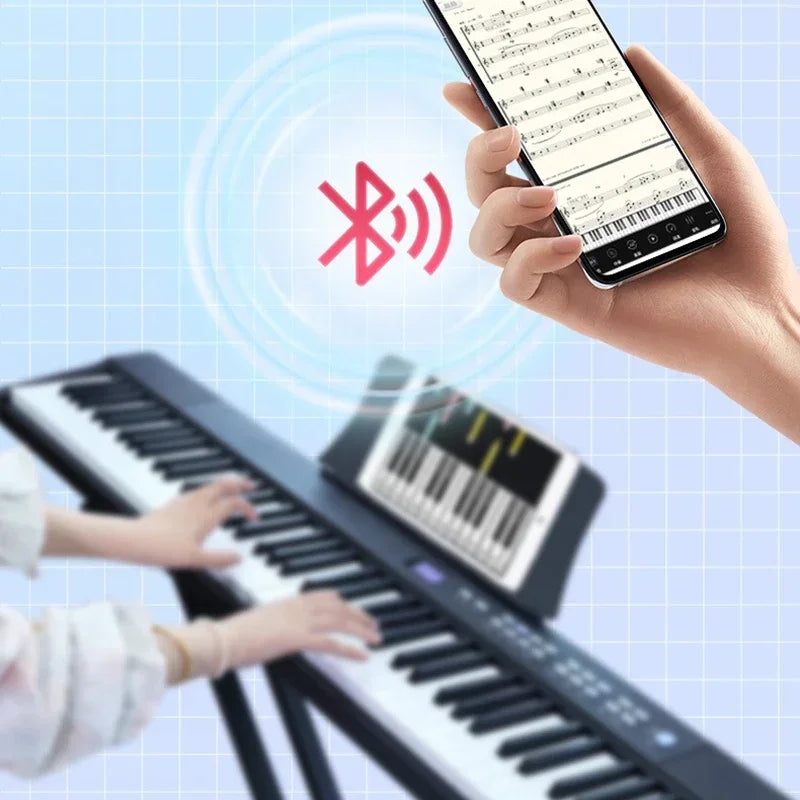 Black and white folding adult electronic piano with 88 keys connected to smartphone via professional midi bluetooth controller