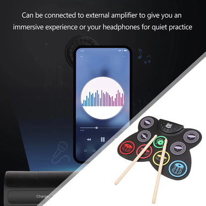 Black inflatable roll-up electronic drum kit with colorful silicone pads and wooden drumsticks for portable practice