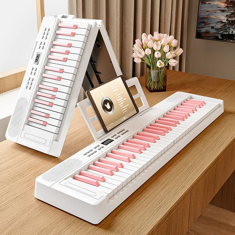 White and pink foldable electronic piano portable with 61 keys and built-in tablet stand for keyboard beginners midi use