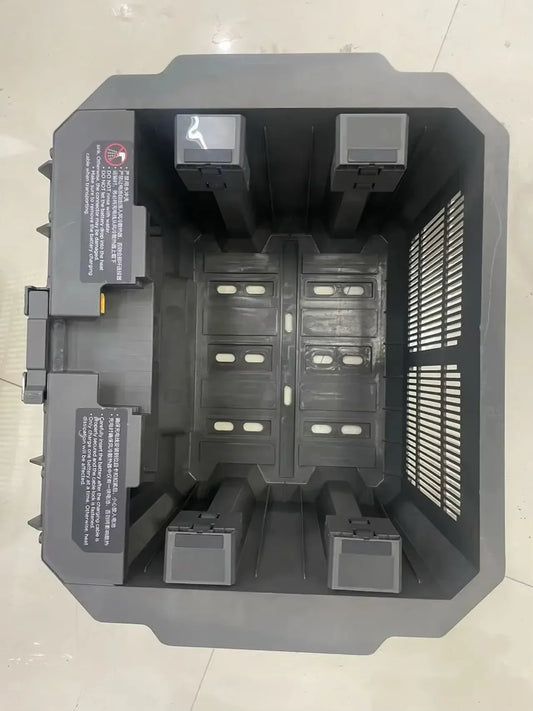 Black plastic battery tray with molded compartments and ventilation slots for agras dj t50 t50 battery air-cooled kit