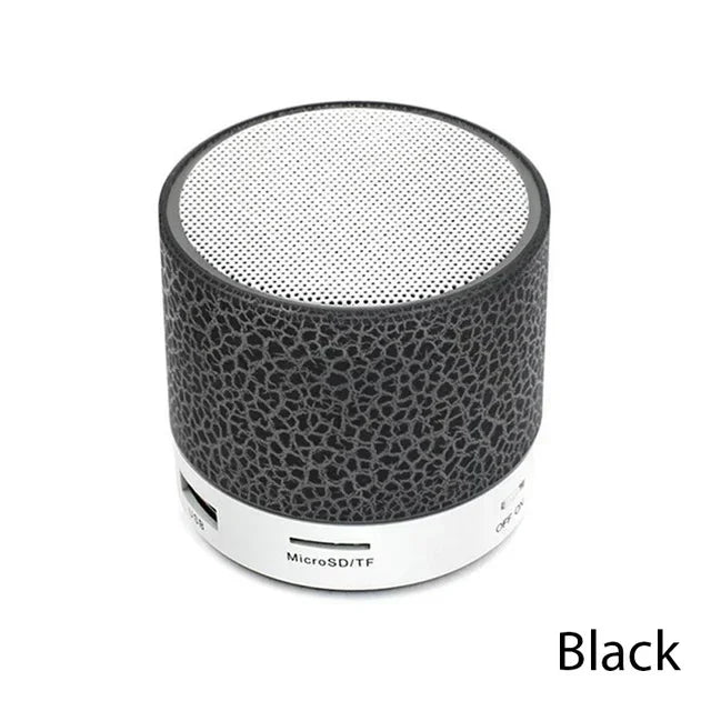 Black cylindrical bluetooth mini speaker led with textured surface and silver mesh grille for car 3d stereo outdoor sound box