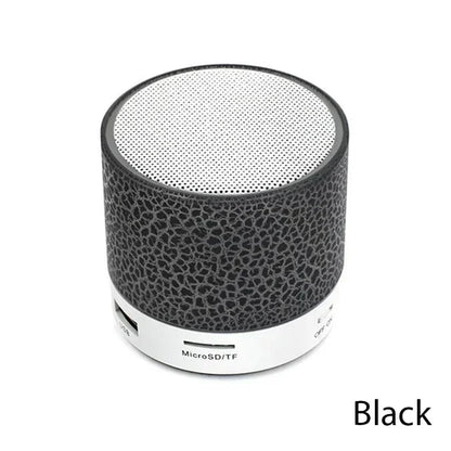 Black cylindrical bluetooth mini speaker led with textured surface and silver mesh grille for car 3d stereo outdoor sound box