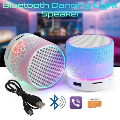 Two cylindrical bluetooth mini speaker led outdoor sound box with crackled texture glowing pink purple and blue violet hues