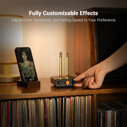 Black rectangular fosi audio rhythm ambient audio effect controller with gold tubes and orange knobs monitor light bar