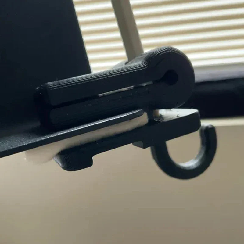 Black plastic folding bow hook with curved end and rectangular base for bow holder organizer on music stand
