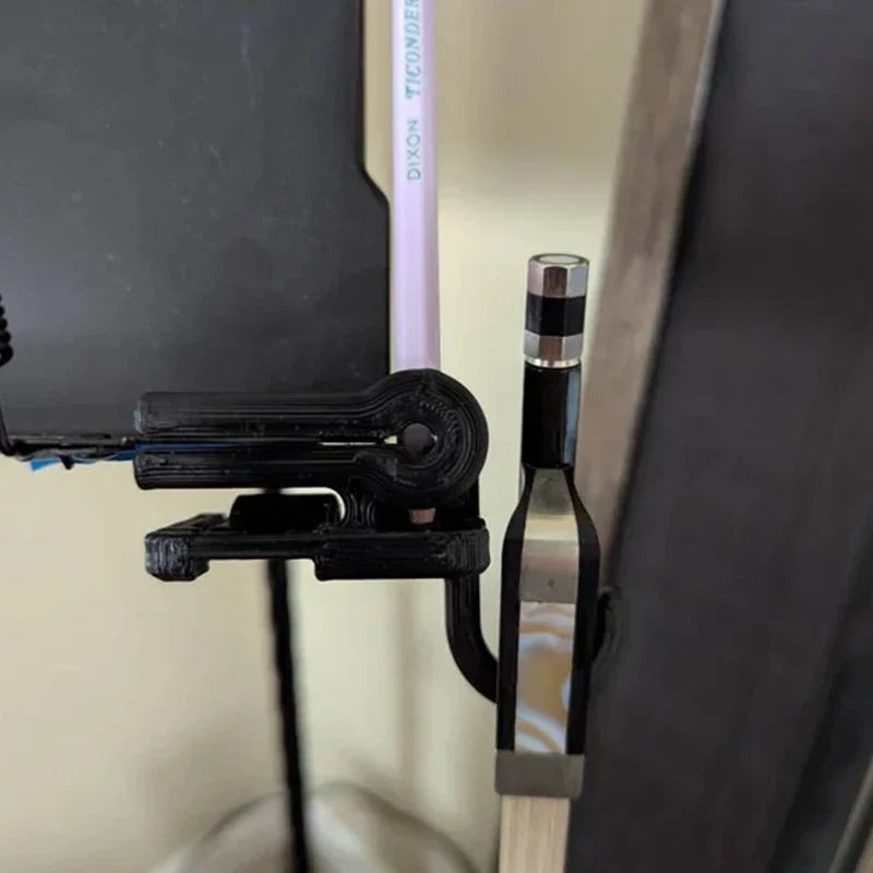 Black plastic folding bow hook desk clamp holding a pencil and electronic device for bow holder organizer