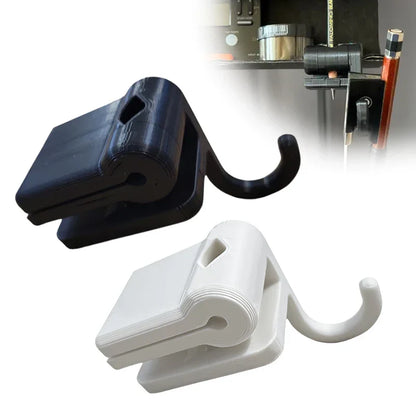 Black and white plastic folding bow hook clips with curved hanging loops for bow holder organizer on music stand