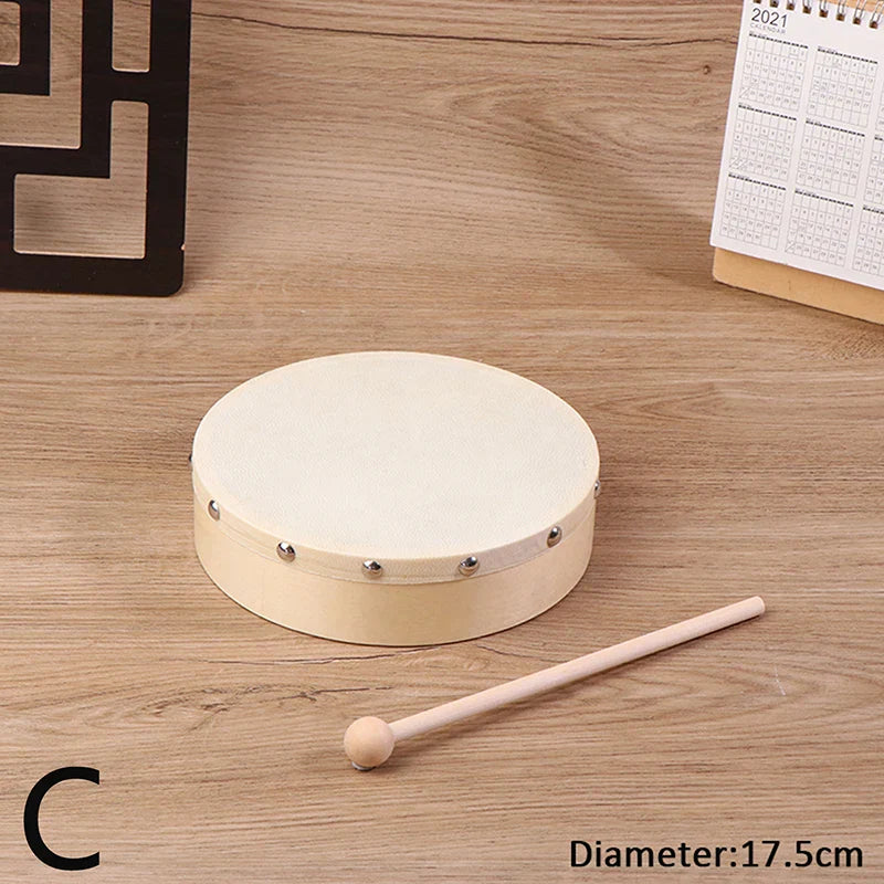Beige circular wooden frame drum with silver rivets and drum stick set ideal for kids educational toy percussion