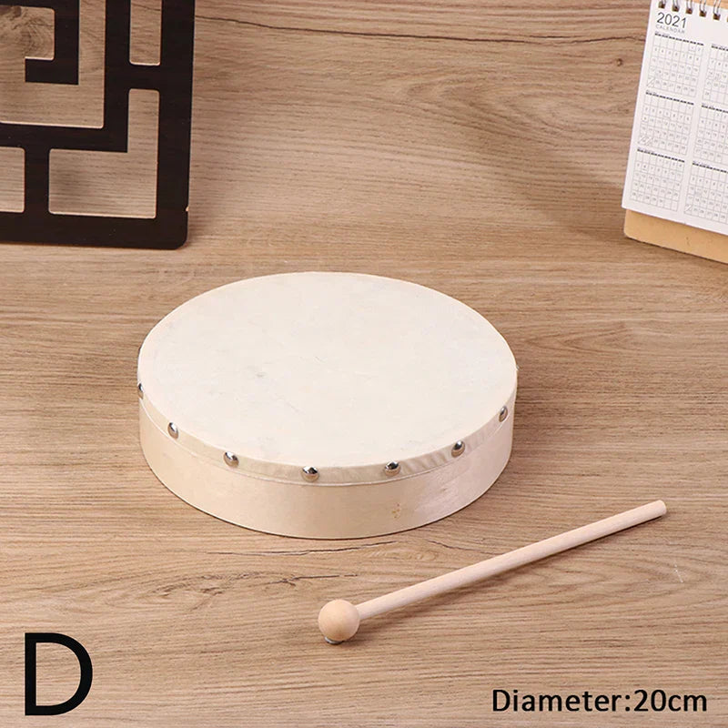 A round off-white frame drum with wooden frame and silver metal studs included in a drum stick set kids educational toy