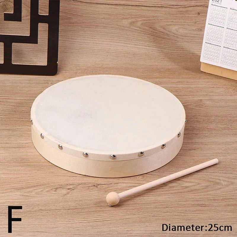 A round off-white frame drum with wooden frame and silver metal studs featuring a drum stick set kids educational toy