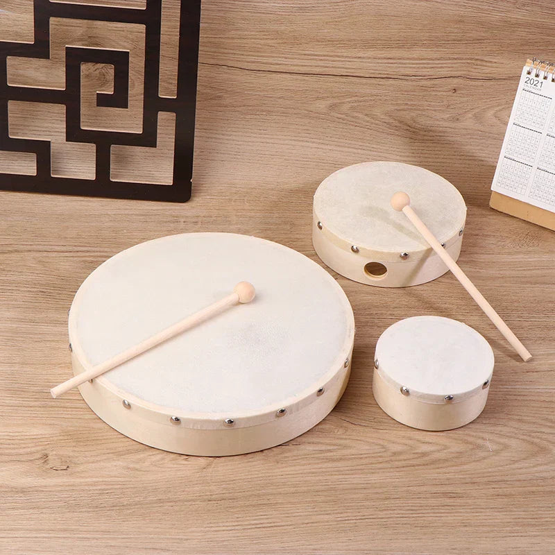 Set of three wooden frame drums with white drumheads and matching drum stick set kids educational toy