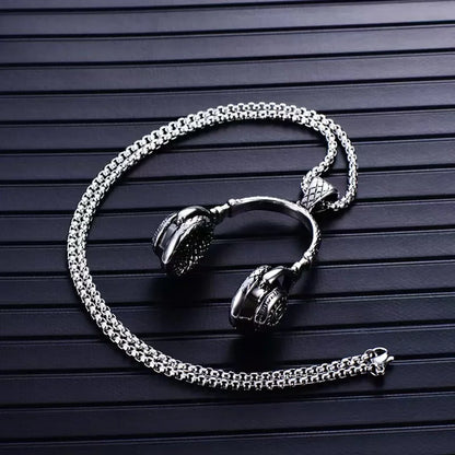Silver-toned stainless steel music headphone pendant necklace with detailed textured fan dj music design and blackened accents