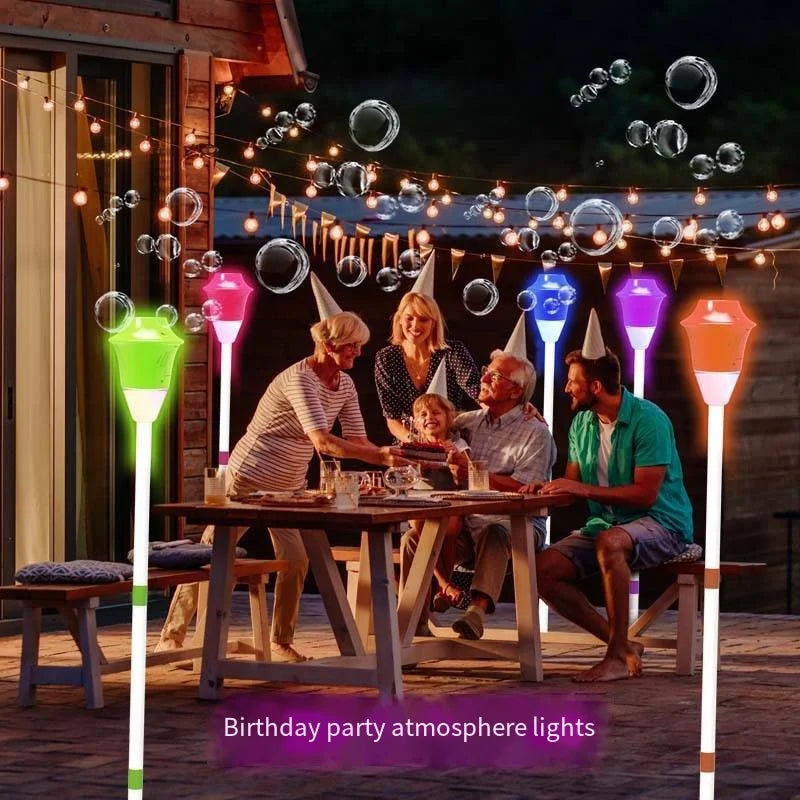 Colorful illuminated party lanterns with glowing tops on slender white poles for bubble machine street use with music lighting