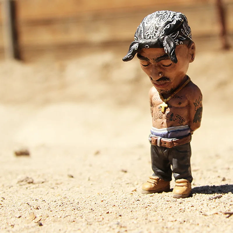 Detailed resin statue of tupac shakur bobblehead with black and white bandana tattoos dark pants tan boots for indoor outdoor decoration