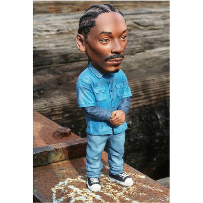 Blue resin statue of snoop dogg rapper funny bro bobblehead wearing blue shirt and jeans for indoor outdoor decor