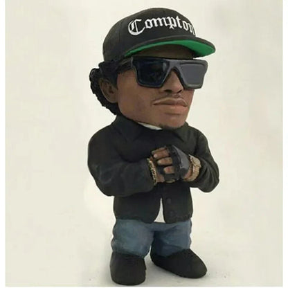 Black resin statue of a hop rapper funny bro wearing green trim compton cap and sunglasses for indoor outdoor decor