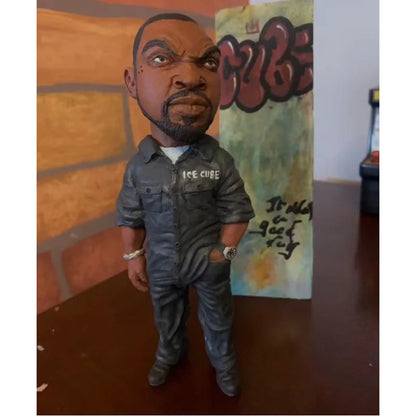 Dark gray resin statue of ice cube rapper funny bro bobblehead in denim jumpsuit for indoor outdoor decoration
