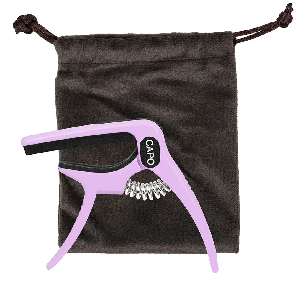 Purple galux universal guitar capo with black rubber grip and silver metal springs featuring a quick metal change clamp key