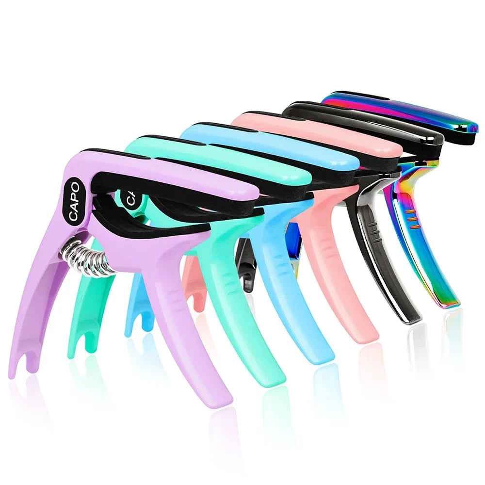 A set of colorful pastel and iridescent galux universal guitar capo quick metal change clamp key accessories