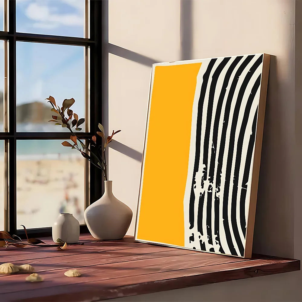 A modern graphic abstract poster with bold black white stripes and a vibrant yellow panel framed in light wood
