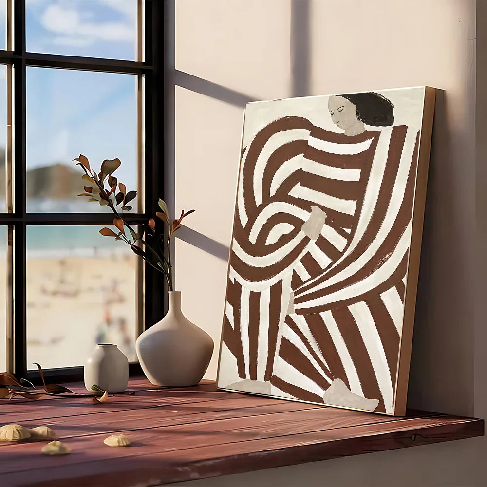 A modern graphic abstract canvas painting with flowing brown and white stripes framed in simple wood