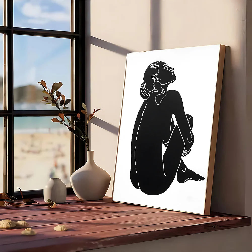 Modern graphic black silhouette art print of a seated woman framed in light wood kraft club vintage wall art poster