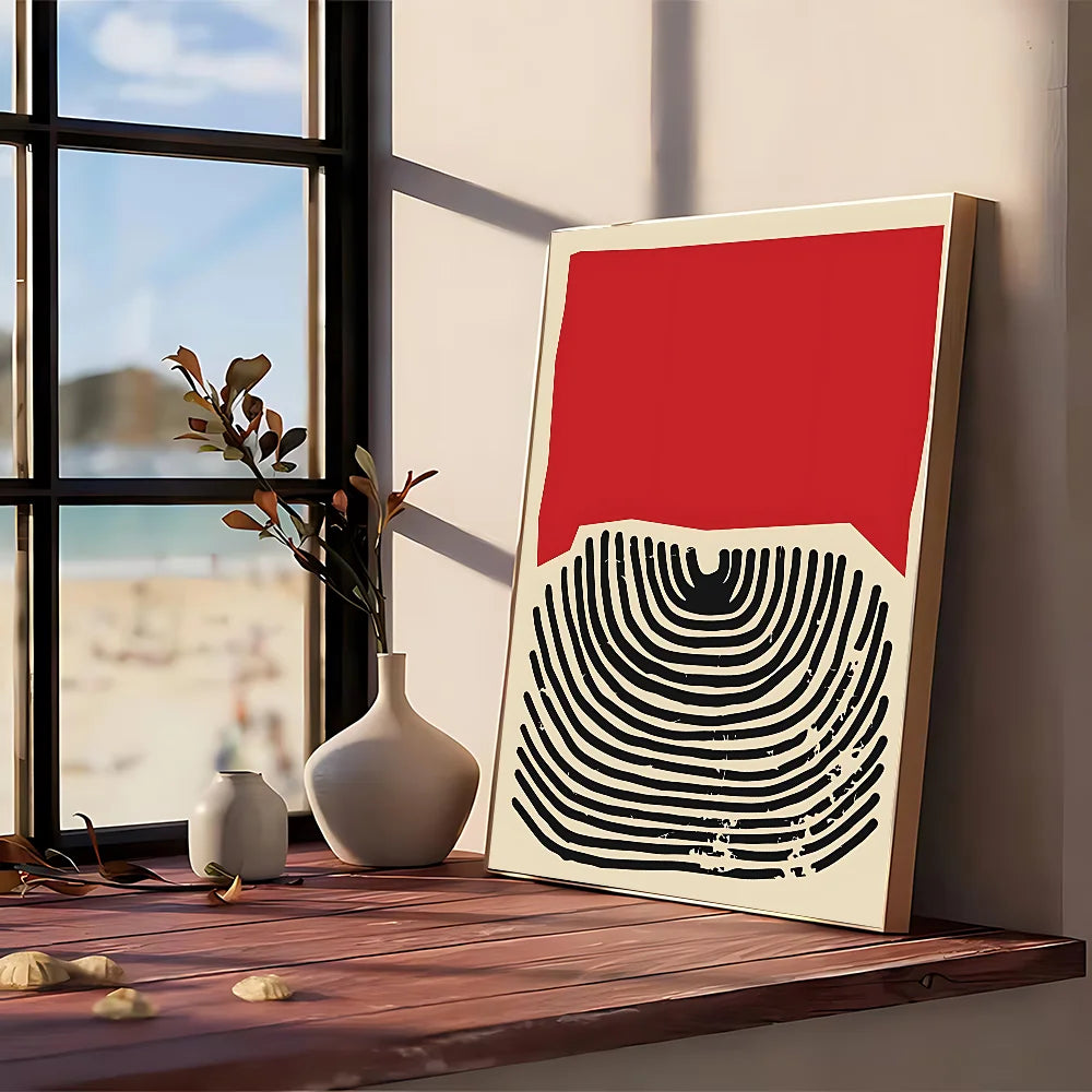 A modern graphic poster featuring bold red and black curved lines on off-white kraft paper framed in light wood