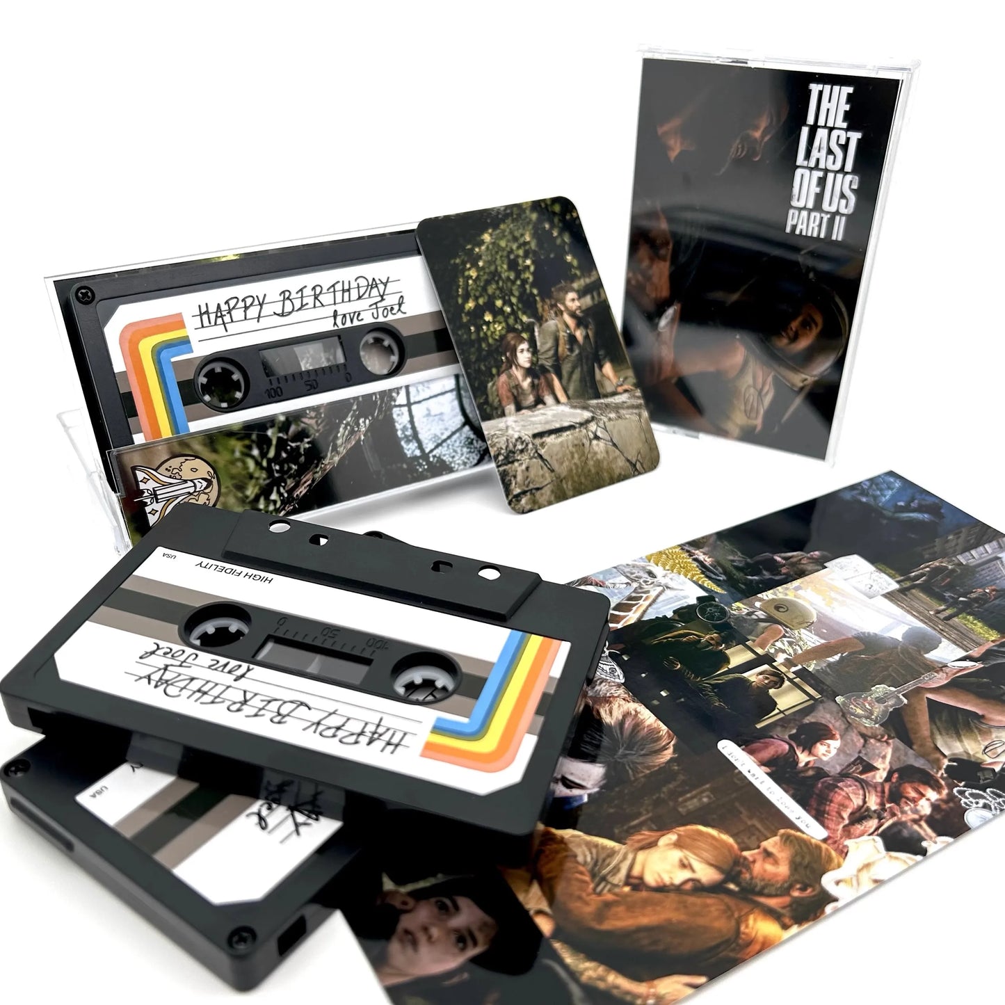 Black cassette tape with rainbow stripes and handwritten happy birthday love joel label for adam young music recorder soundtracks box