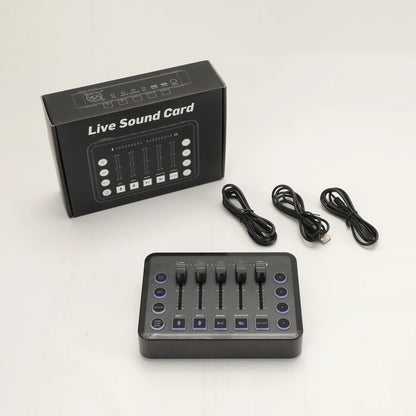 Black rectangular gaming audio mixer with four vertical faders, purple illuminated buttons, and matte finish for podcast recording