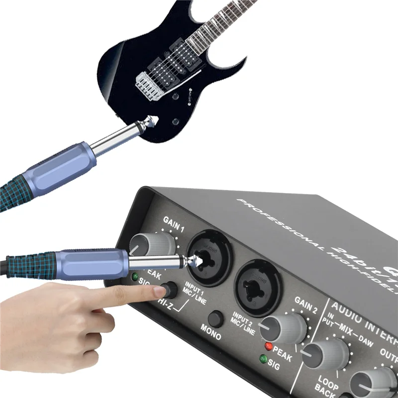 Black electric guitar with silver hardware connected via blue cables to professional 24bit 192khz audio interface for electric guitar loopback studio pc recording