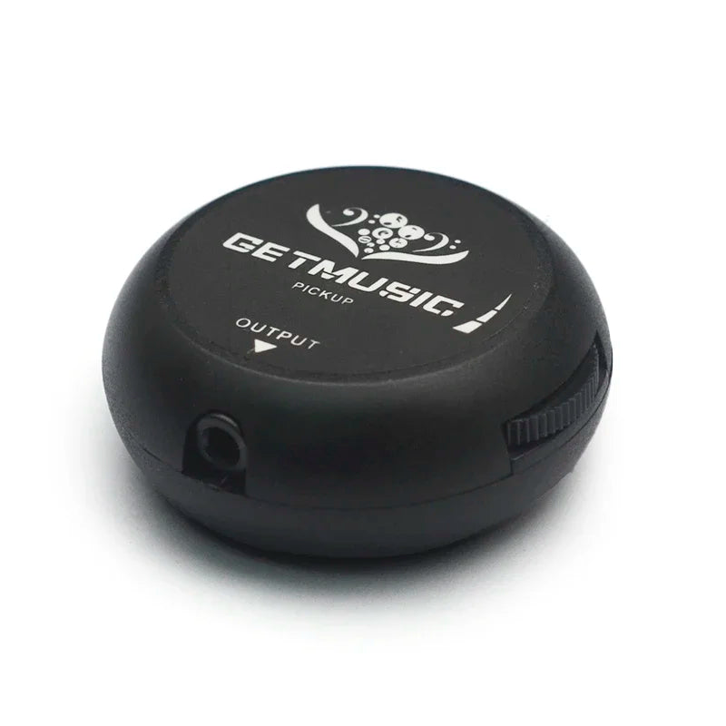 Black circular getmusic guitar pickup piezo with matte finish and white branding for acoustic classical violin and more