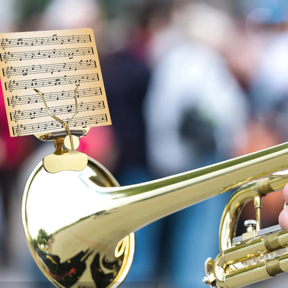 Gold-colored brass trumpet with golden trombone marching music holder lyre stand clip-on for marching band flip use