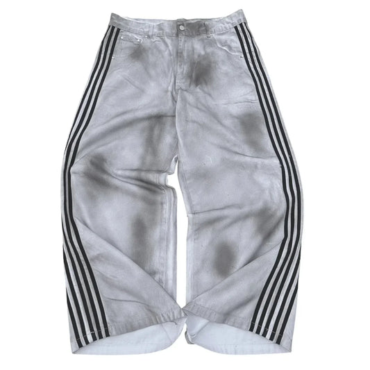 Silver-gray distressed denim pants with three bold black stripes down each leg in a gothic punk y2k hoodie two piece set
