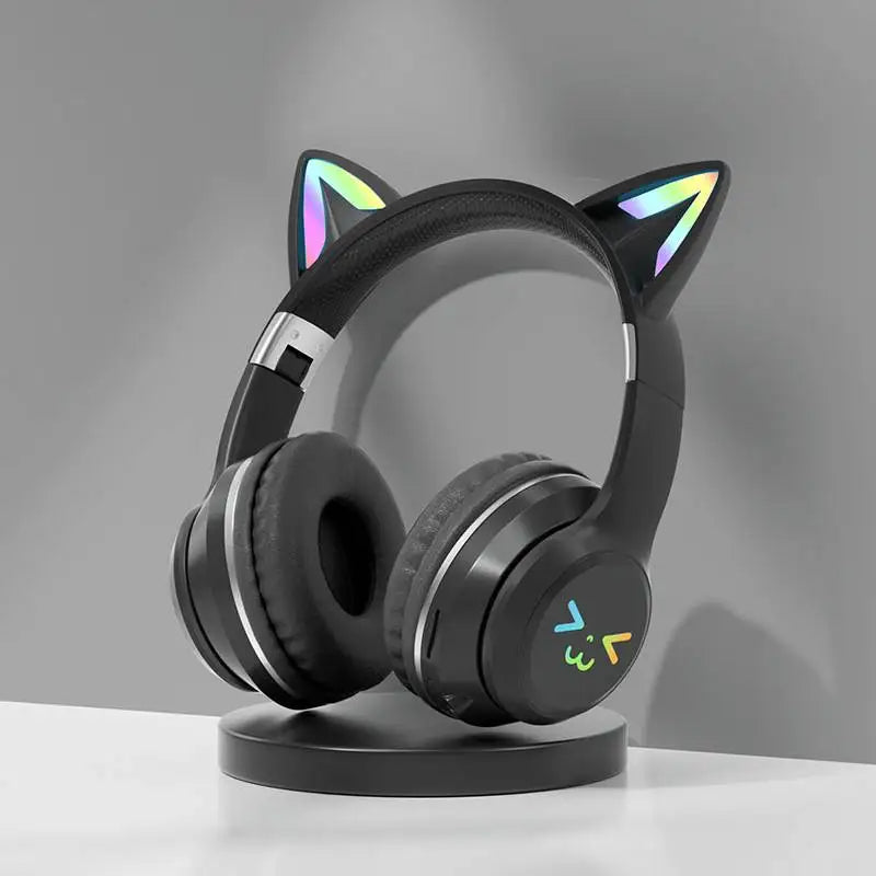 Black gradient wireless headphones with illuminated cat ear bluetooth accents and microphone stereo music feature