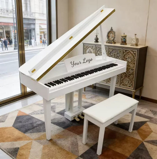 White grand piano electronic with gold trim black keys and customizable logo plaque on the fallboard for professionnel use