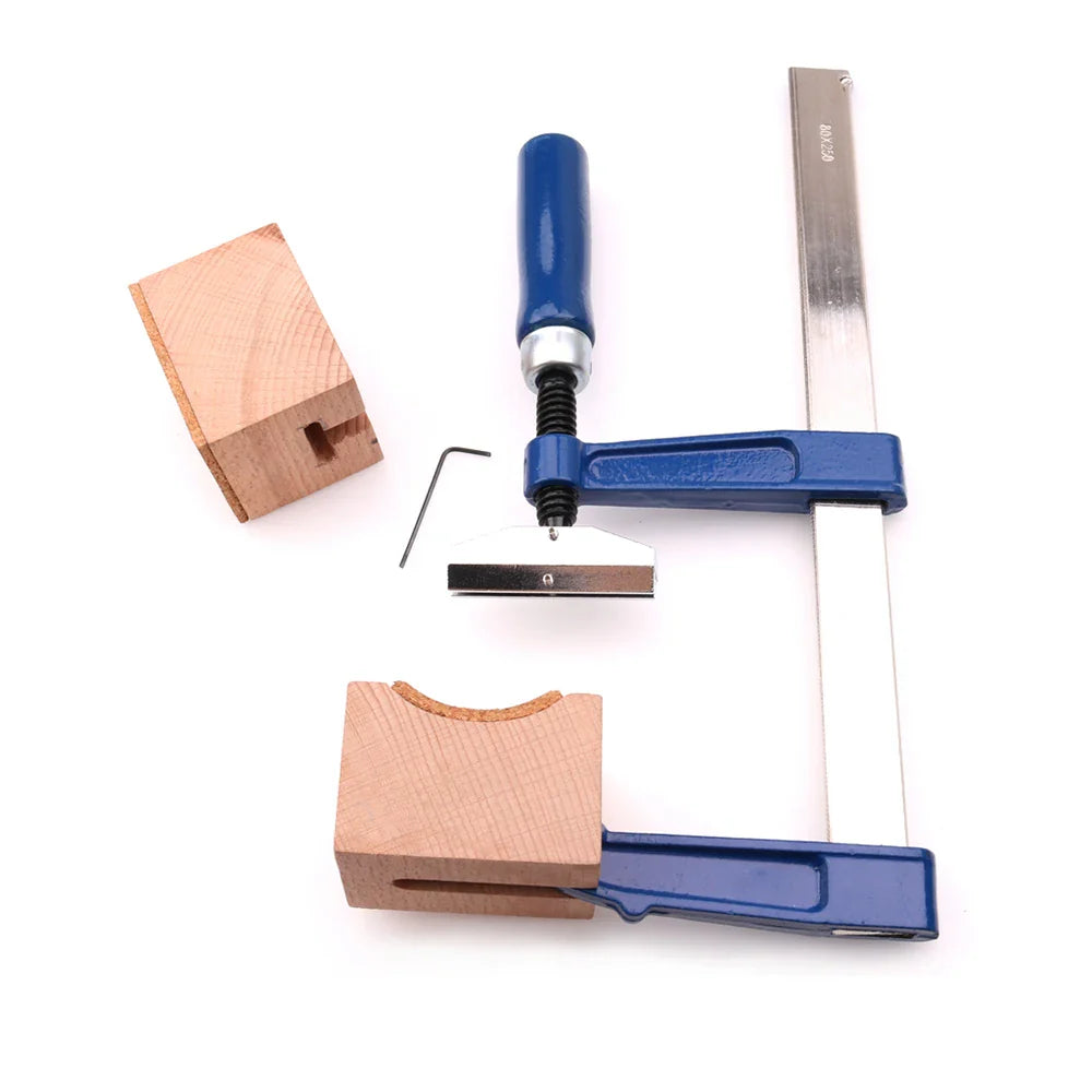Blue-handled fret press tool with metallic frame and adjustable screw mechanism including mini hexagonal wrench for luthier use