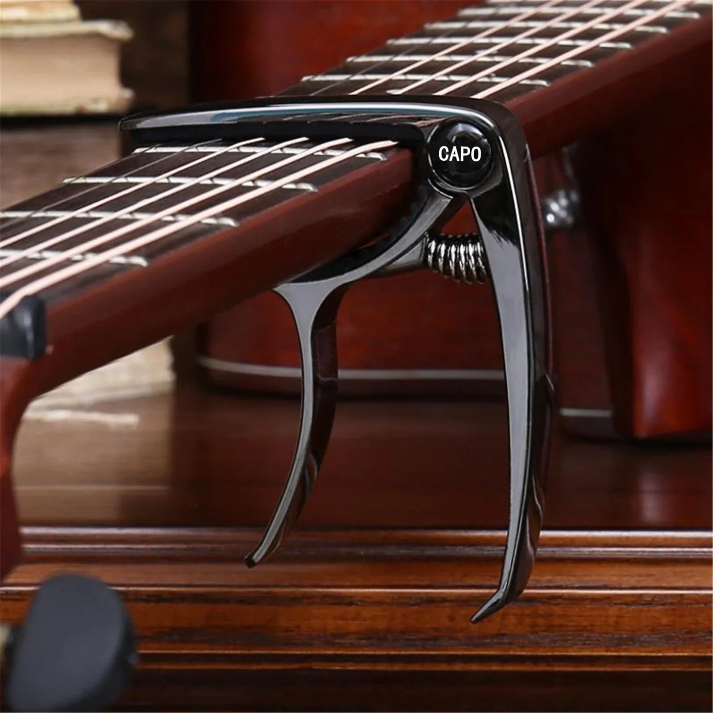 Black metal guitar capo metal with spring mechanism and capo engraved on zinc alloy guitar tuner clamp knob