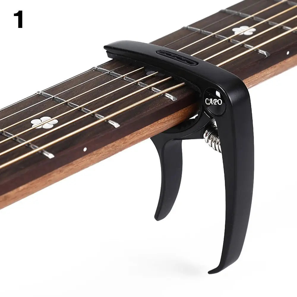 Black metal guitar capo metal with spring mechanism and capo engraving clamped on acoustic electric musical guitar fretboard alloy guitar tuner clamp
