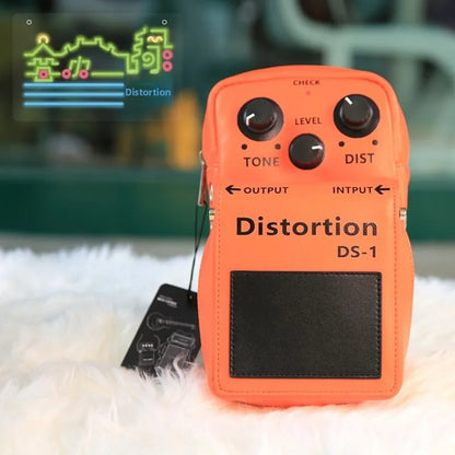Orange distortion ds-1 guitar effect pedal with black knobs and footswitch plate featured with effect backpack crossbody