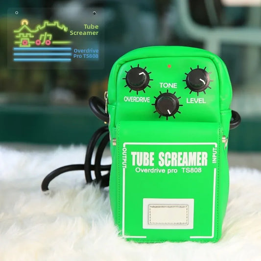 Vibrant green leather-like guitar effect backpack resembling ts808 pedal with black knobs and white labeling for musicians