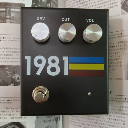 Black 1981 guitar effects pedal with silver drv cut vol knobs featuring unique mid-frequency overdrive and ukrainian flag design