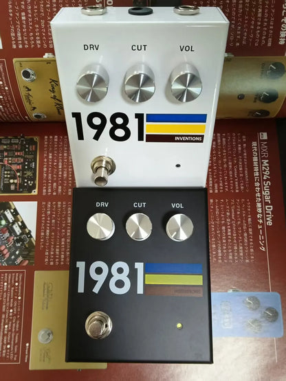 White and black 1981 guitar effector pedal with silver knobs and unique mid-frequency yellow blue brown stripe design