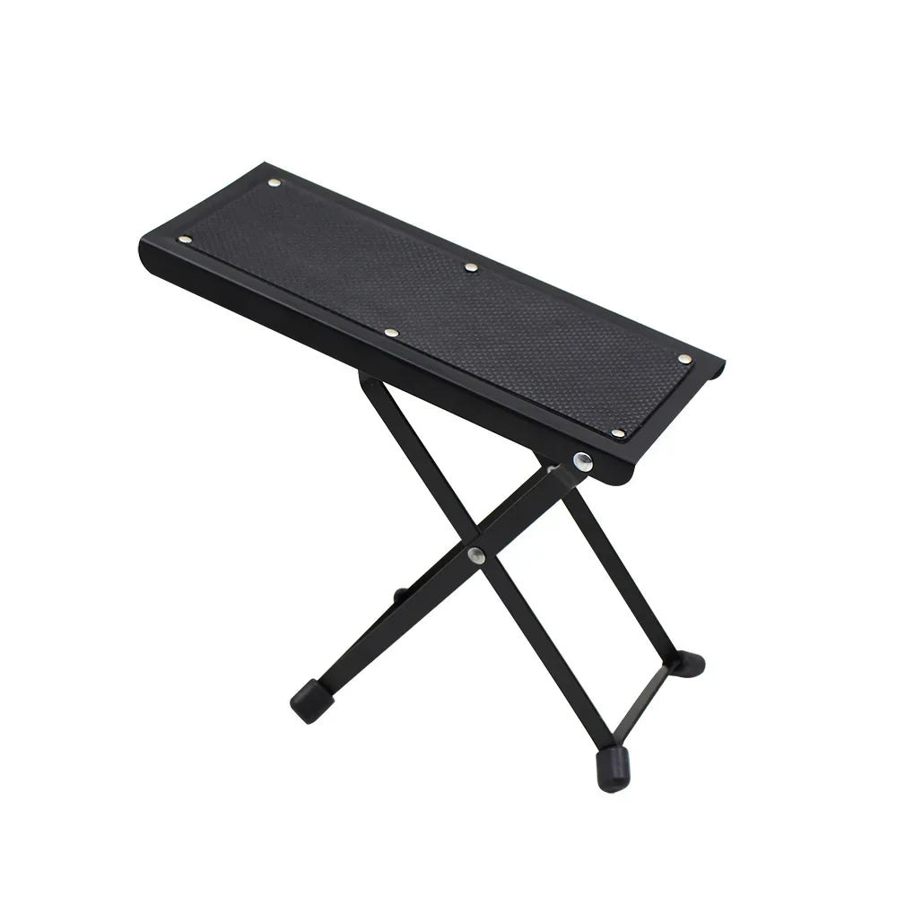 Black foldable guitar pedal foot stool with textured footrest and rubberized feet for guitar pedal accessories