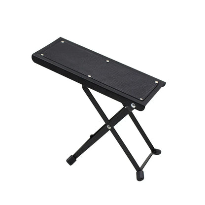 Black foldable guitar pedal foot stool with textured footrest and rubberized feet for guitar pedal accessories