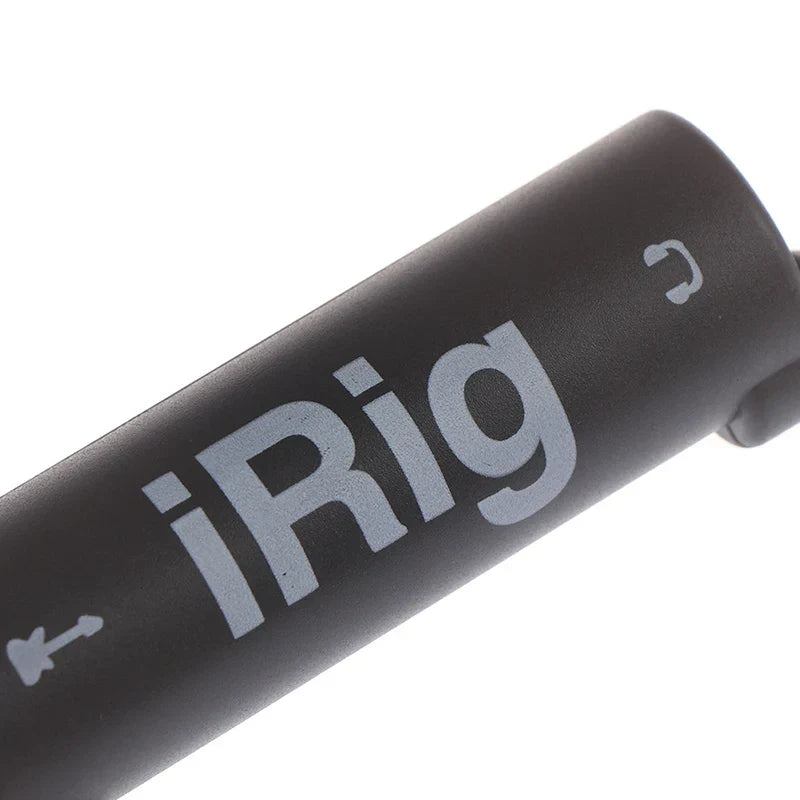 Black cylindrical irig guitar audio interface with silver branding designed as a phone guitar audio tuner converter
