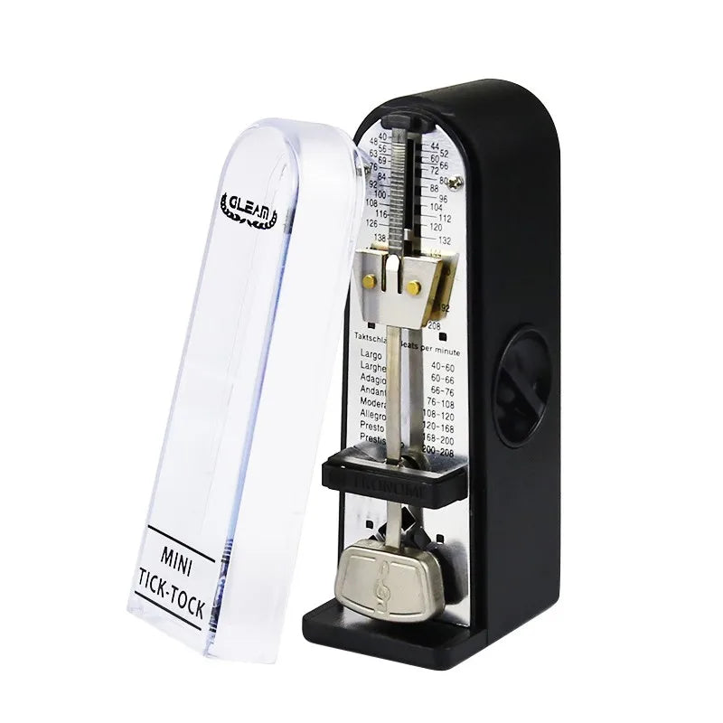 Black and silver mechanical metronome with clear plastic cover labeled mini tick-tock and engraved musical tempo markings