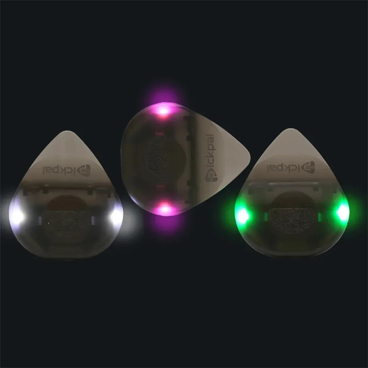Three translucent plastic instrument glowing plectrums with led lights in white purple and green for bass electric guitarists