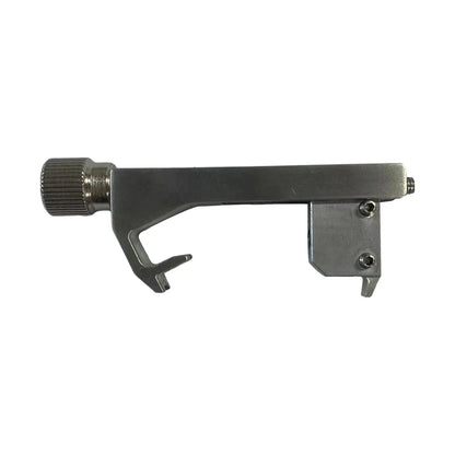 Silver-toned metal guitar tone calibrator with knurled adjustment knob and two screws for professional guitar accessory use